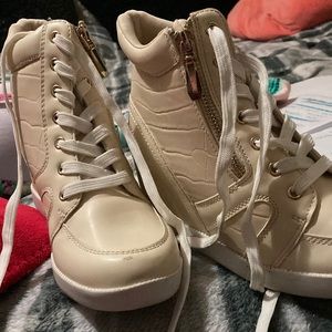 Cute high top heel boots .